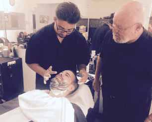 Beard Shaving — Man Shaving Customer's Beard in Tucson, AZ